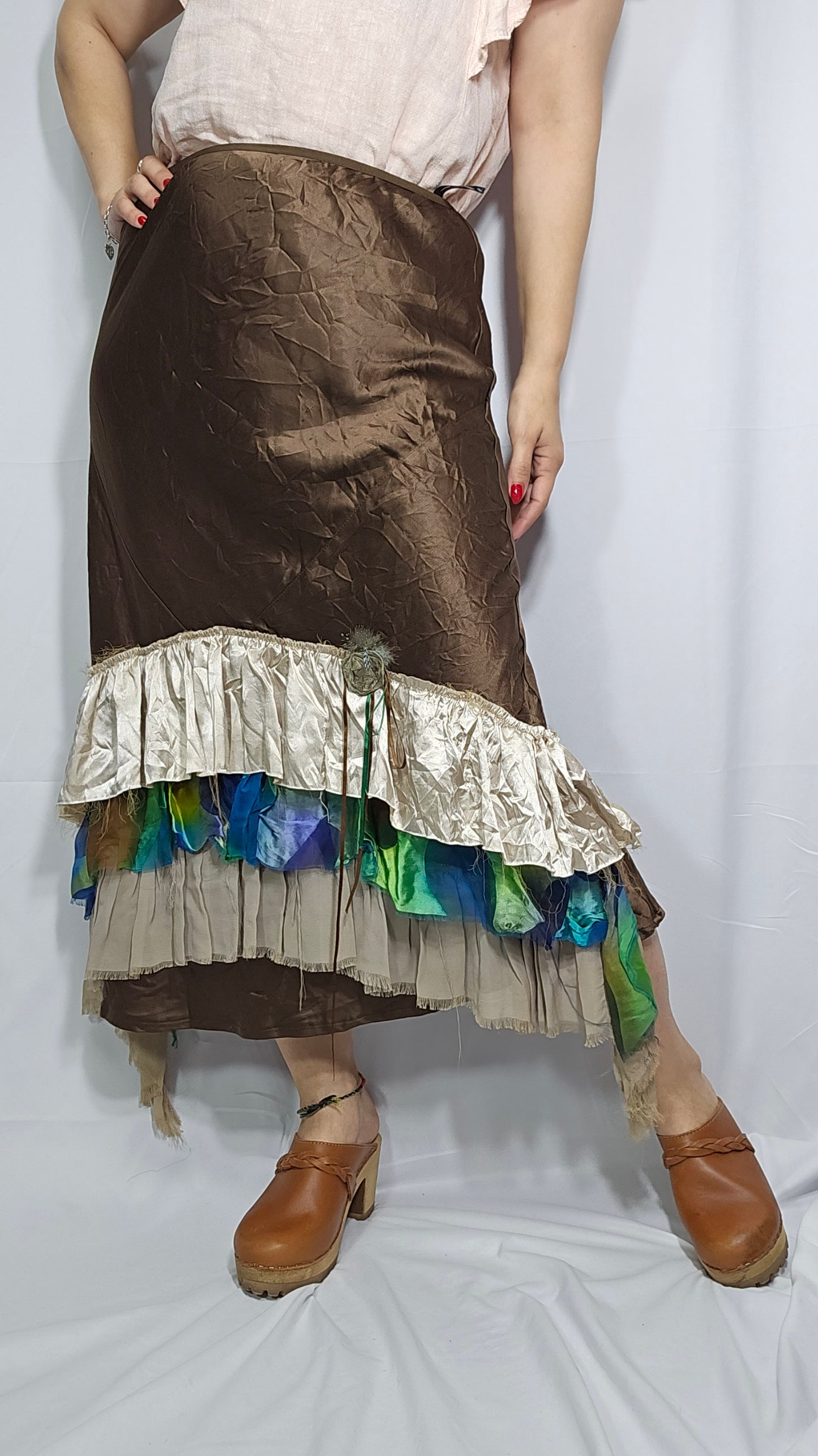 brown skirt with a layered hem featuring multicolored patterns, in preloved condition, size small, medium, large