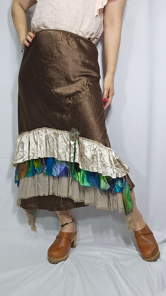 brown skirt with a layered hem featuring multicolored patterns, in preloved condition, size small, medium, large
