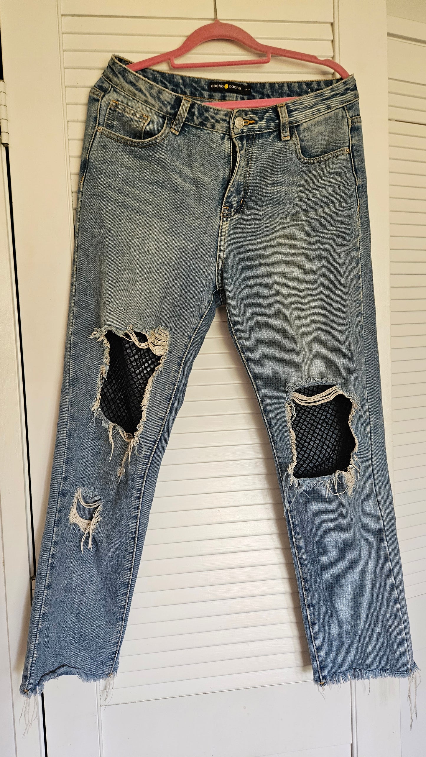 lovely denim size medium ewith net details ripped in good preloved conditionin auckland