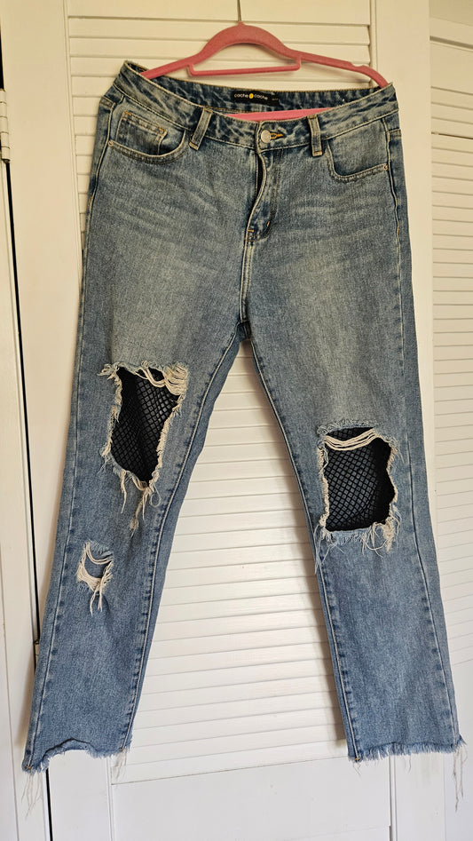 lovely denim size medium ewith net details ripped in good preloved conditionin auckland