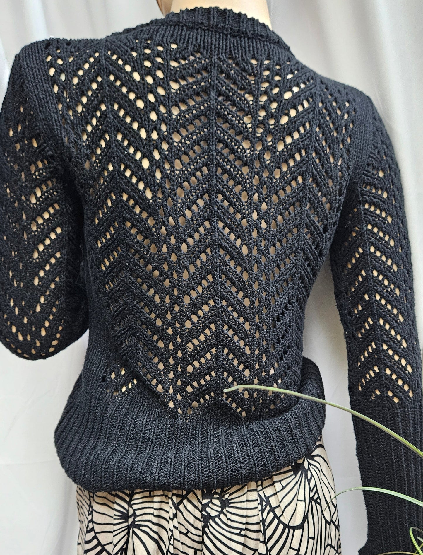 black knitted sweater in size medim in preloved condition