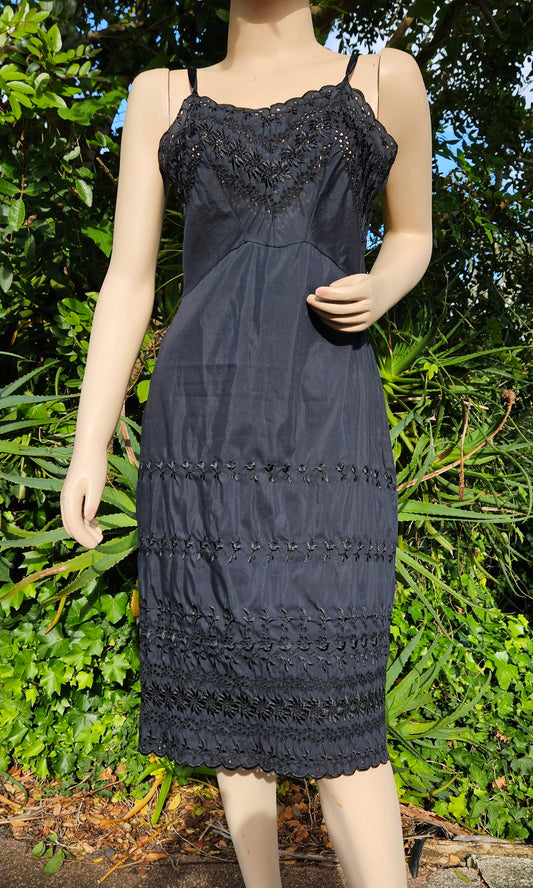 Adorable Black Midi Dress with embroidery details.