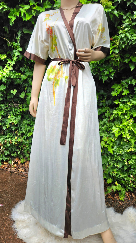 vintage white satin robe with floral print details and a matching slip dress. The robe has a belt and the two pieces in good preloved condition. Size large available at paothrift.co.nz