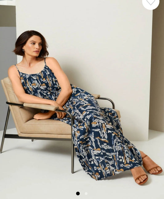 blue and white pleated panelled dress with a round neckline and spaghetti straps.