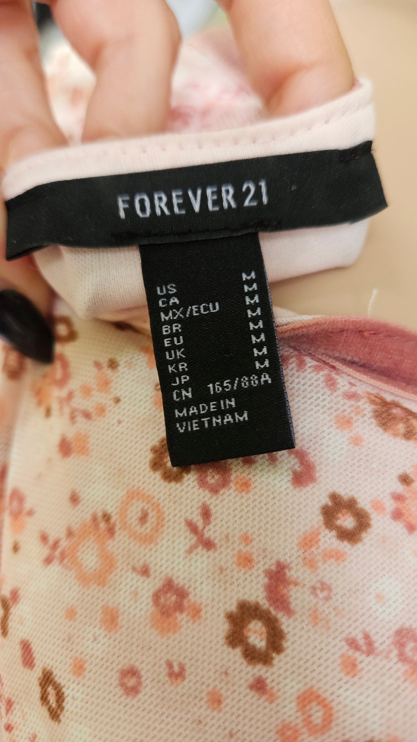 Forever 21 label on a floral fabric dress