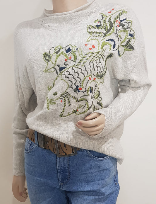 A BEIGE sweater with embroidered appliqués in green, blue, and ORANGE, in good preloved condition, size 8 small available online and in Auckland new zealand