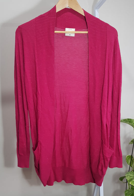 A hot pink, long, cardigan-style coat with a V-neck and long sleeves, displayed on a hanger against a neutral background. Szie XS (size 6-8-10) in preloved condition. Available at Auckland New Zealand