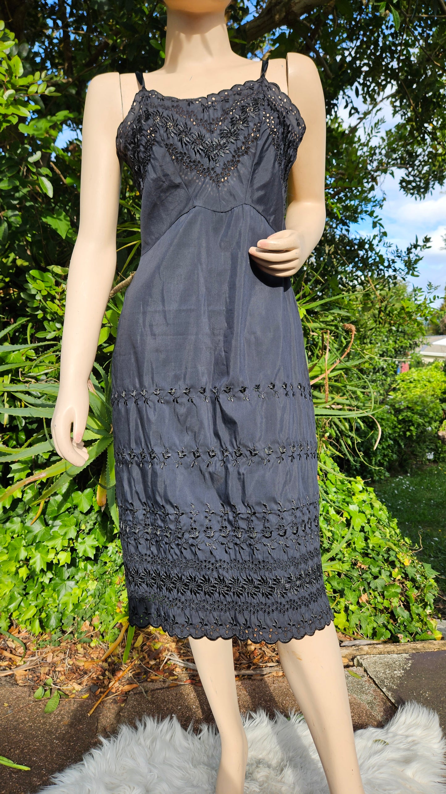 Adorable Black Midi Dress with embroidery details.