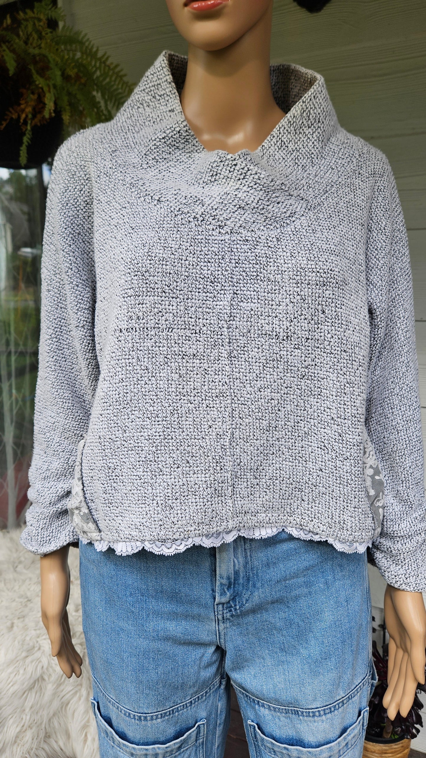 a gray textured sweater by lace made in new zealand