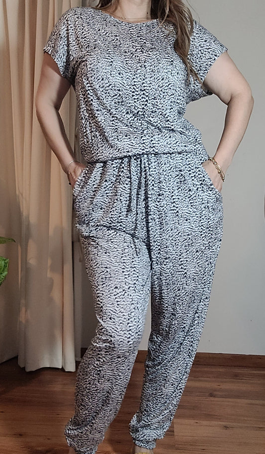 grey jumpsuit New condition in size Medium available at our online second hand store paothrift.co.nz 